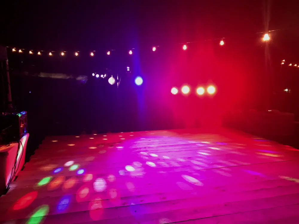 Dance floor lit with colorful party lights